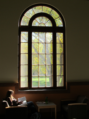student studying in by TILT Great Hall window